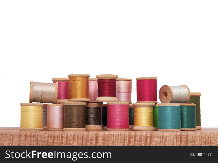 Various Spools of Colorful Thread on a White Background. Various Spools of Colorful Thread on a White Background