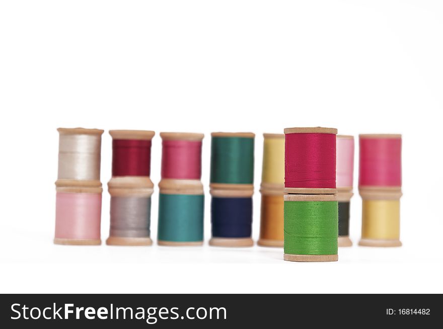 Various Spools of Colorful Thread on a White Background. Various Spools of Colorful Thread on a White Background