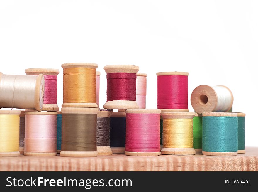 Various Spools of Colorful Thread on a White Background. Various Spools of Colorful Thread on a White Background