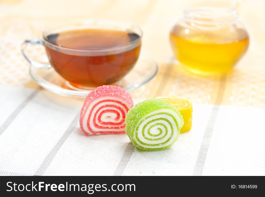 Colored Jelly And Mug With Tea