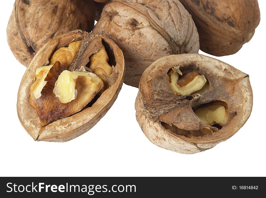 Some walnuts fragment (whole and a cracked) isolated over white background