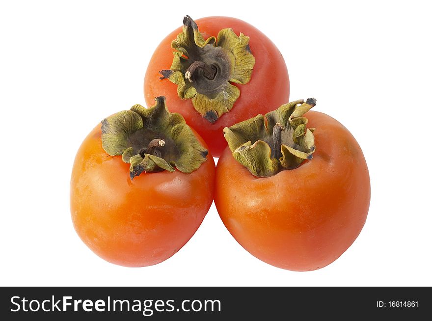 Three ripe persimmons isolated over white background (macro shot). Three ripe persimmons isolated over white background (macro shot)