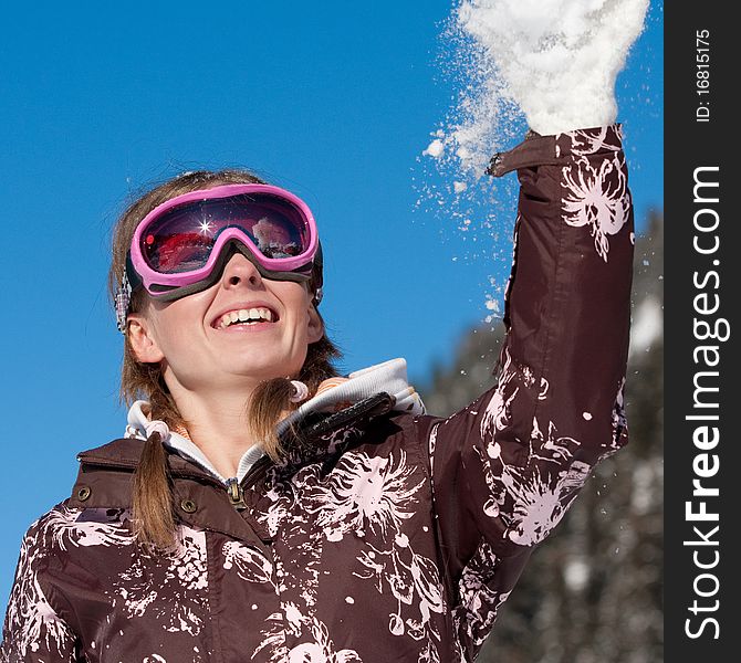Happy girl playing with snowflakes. Winter sport vacation. Happy girl playing with snowflakes. Winter sport vacation