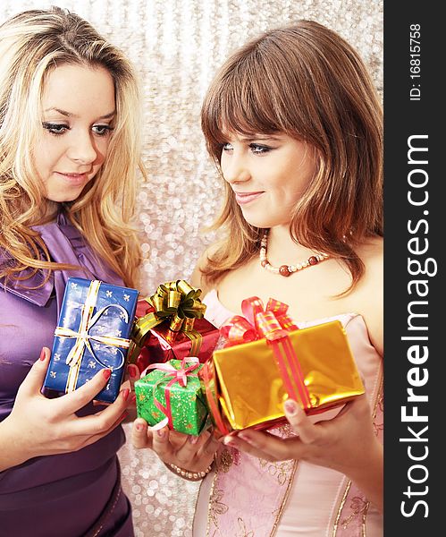 Two friends change by the Christmas gifts