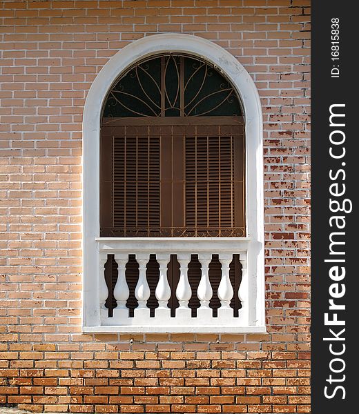 Window with a brick wall tiles apparent. Window with a brick wall tiles apparent