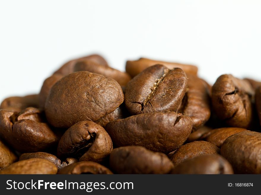 Many coffebeans on white background