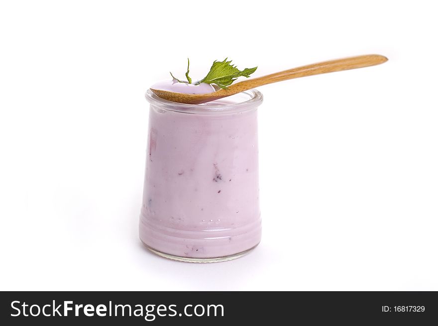 Bowl of blueberry yoghurt on white background