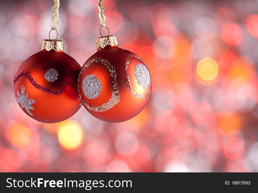 Christmas Ornaments in front of abstract, blurred lights background. Christmas Ornaments in front of abstract, blurred lights background