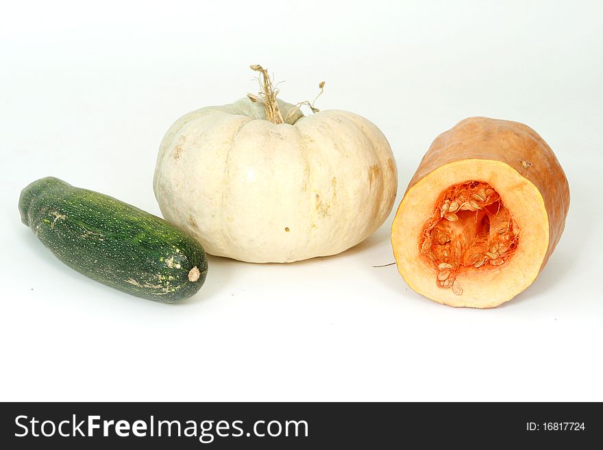 Pumpkin and vegetable marrow on white background