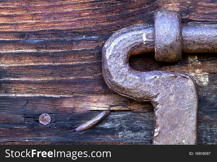 Latch and nails in a wooden prtone