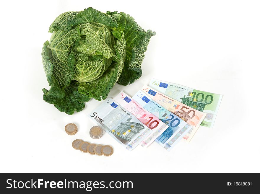 A head of savoy cabbage  with five banknotes on white background. A head of savoy cabbage  with five banknotes on white background