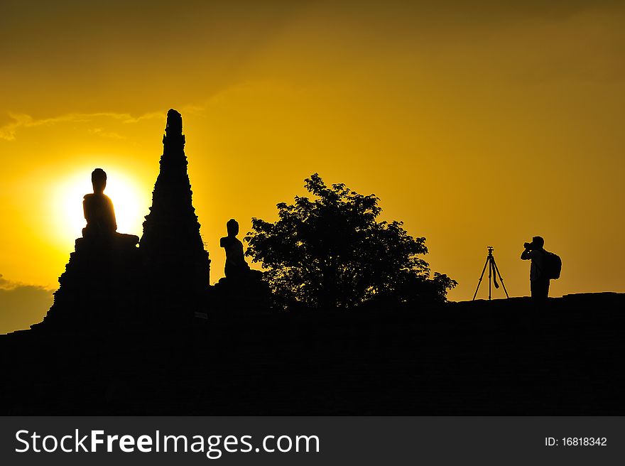 Silhouette photographer with buddha, Chaiwattanaram temple, Ayutthaya, Thailand