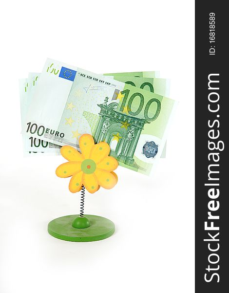 Three one  hundred euro banknotes and yellow flower on white background. Three one  hundred euro banknotes and yellow flower on white background