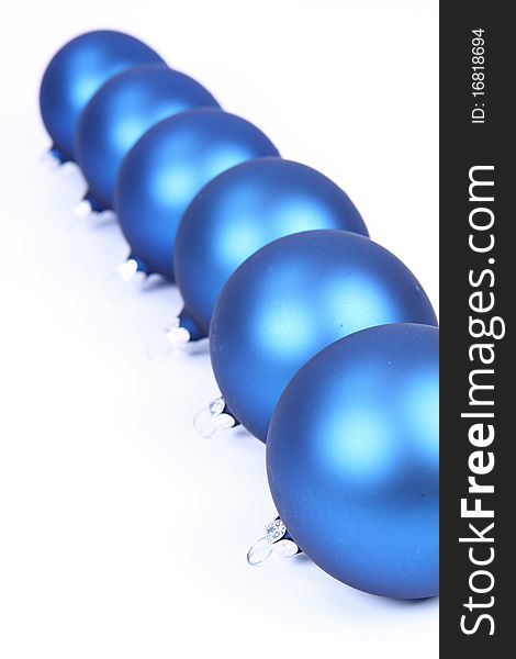 Blue matt christmas balls on white background, with space for your text