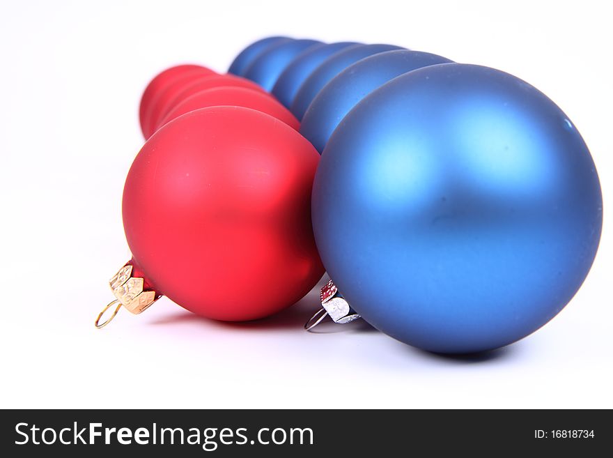 Blue and red matt christmas balls on white background, with space for your text