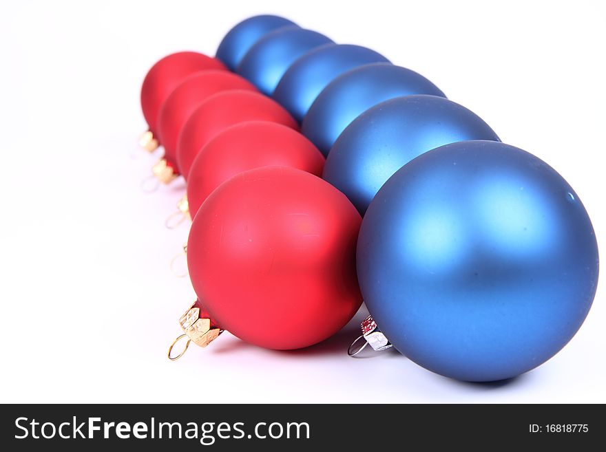 Blue and red matt christmas balls on white background, with space for your text. Blue and red matt christmas balls on white background, with space for your text