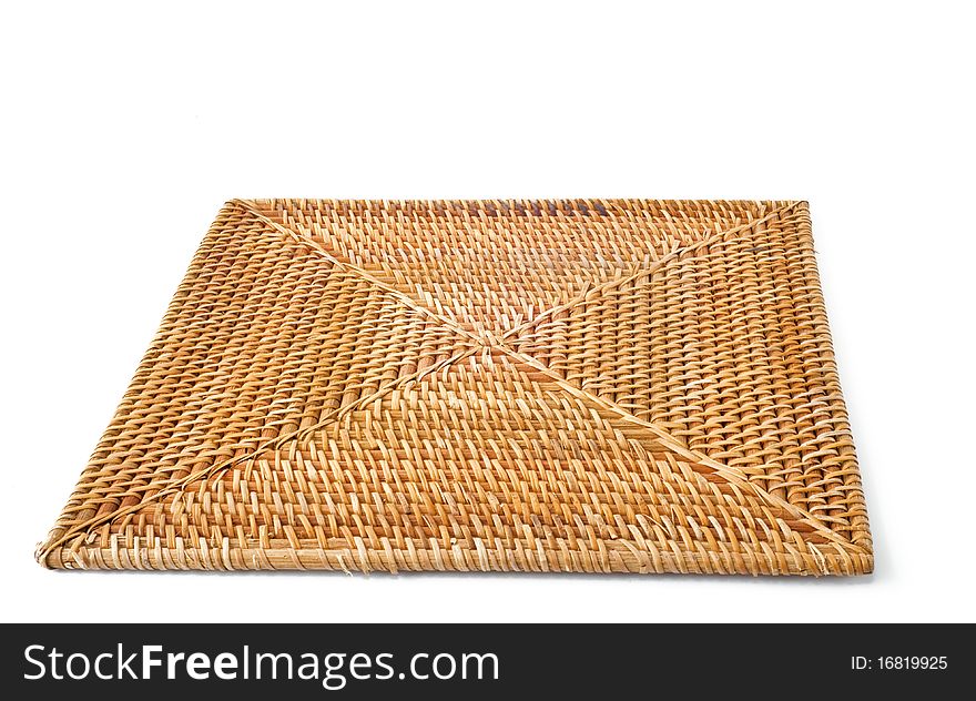 A wicker plate square on white background. A wicker plate square on white background