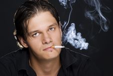 Man Smoking A Cigarette Royalty Free Stock Photos