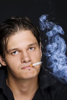 Man Smoking A Cigarette Royalty Free Stock Photography