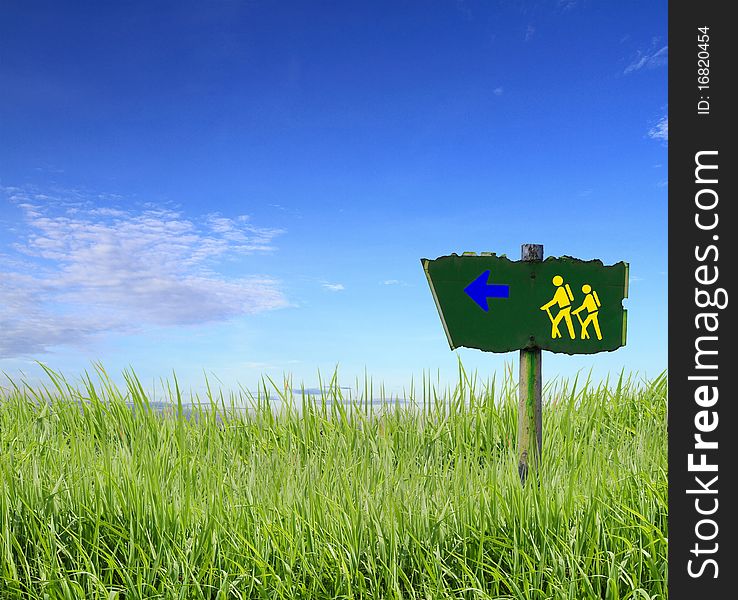 Sign With A Green Meadow