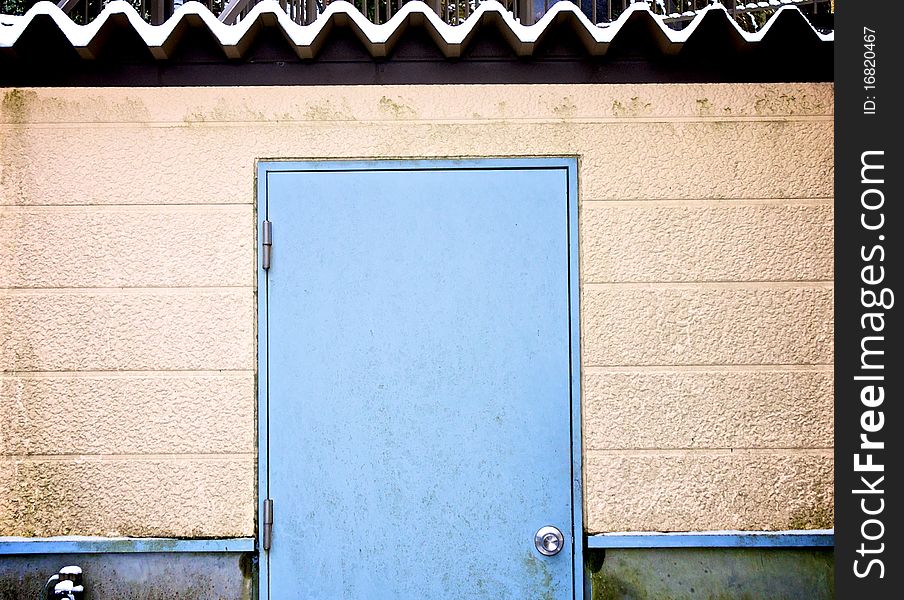 Blue door with snow roof