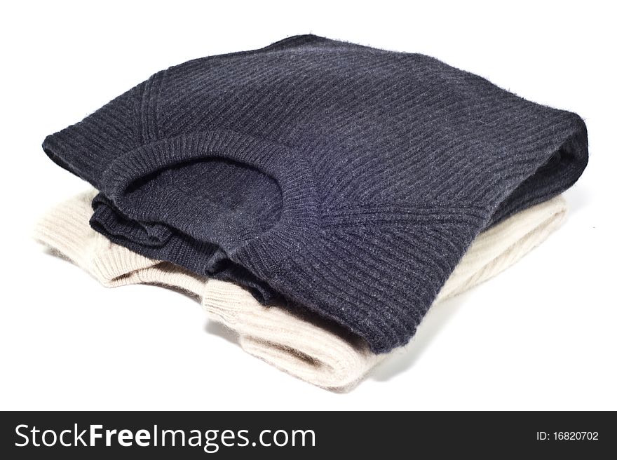 Two cashmere sweaters over white background. Two cashmere sweaters over white background
