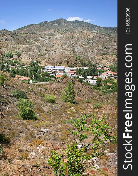 Cyprus village in mountains, vertical picture.