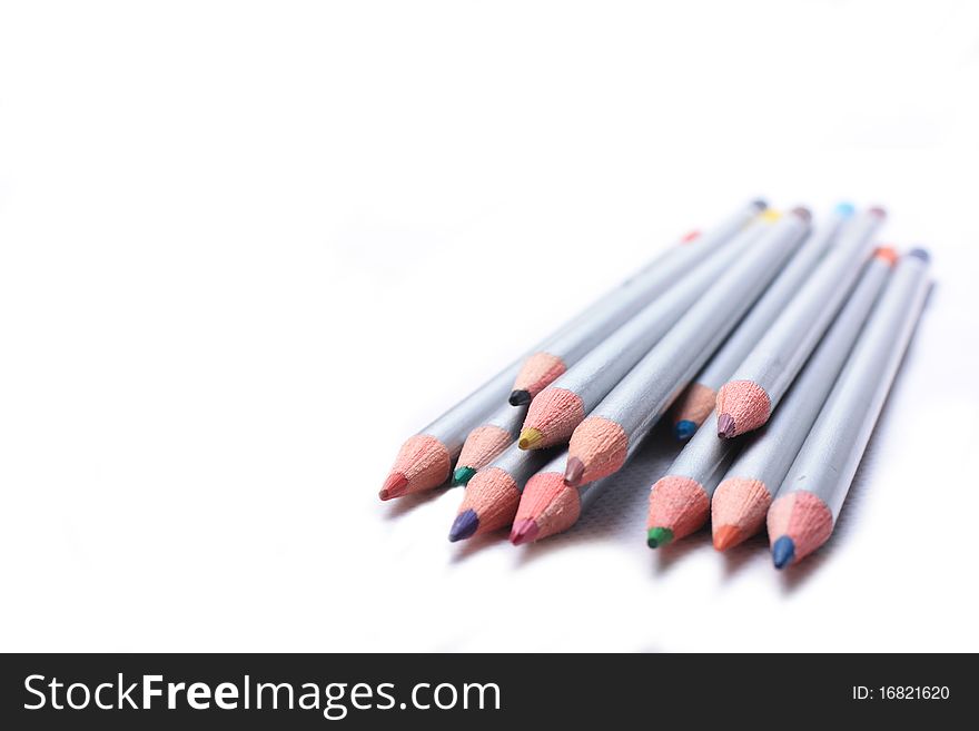 A set of coloured pencils in a slanted line. A set of coloured pencils in a slanted line