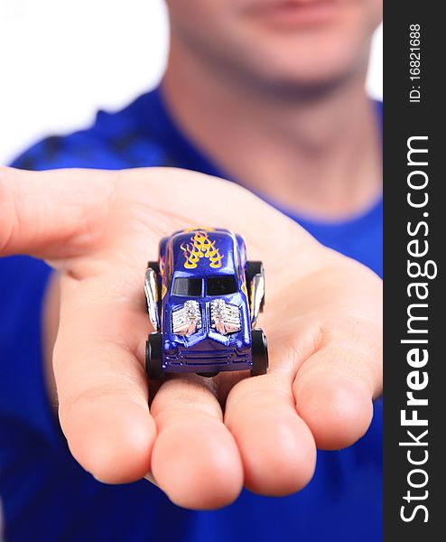 Man holding out a car with good depth of field. Man holding out a car with good depth of field