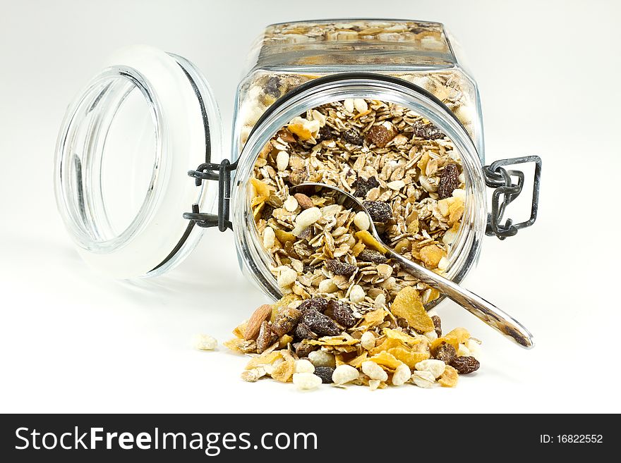 Muesli Breakfast with spoon on white