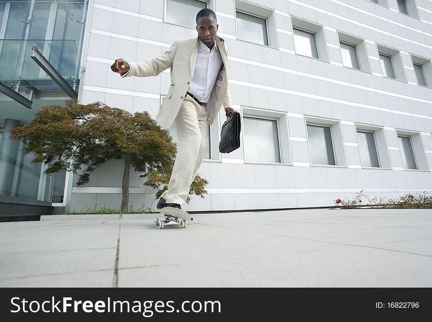 Businessman on skateboard; could be a ecological mode of transport