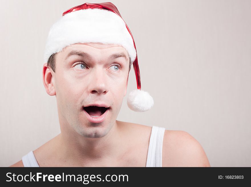 Surprise and fun man in santa hat. Surprise and fun man in santa hat