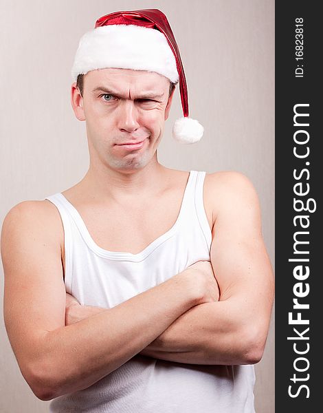 Angry man in santa hat. Angry man in santa hat