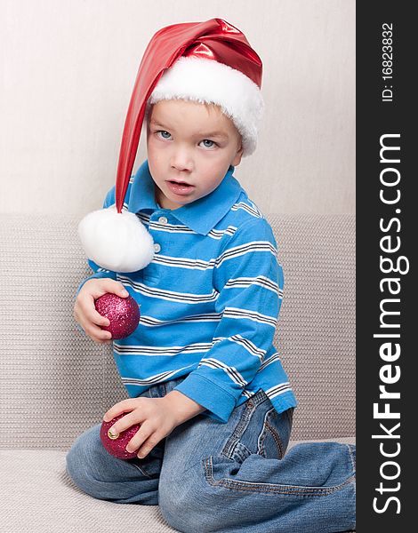 Little boy in red christmas hat