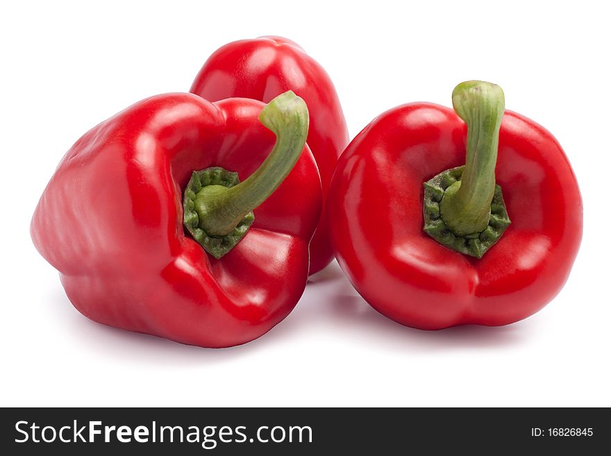 Red paprikas on white background