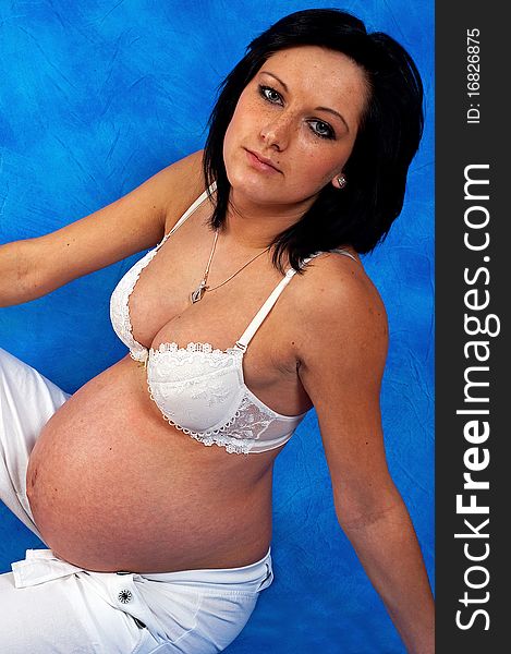 Pregnant woman on the blue mosaic background. Pregnant woman on the blue mosaic background