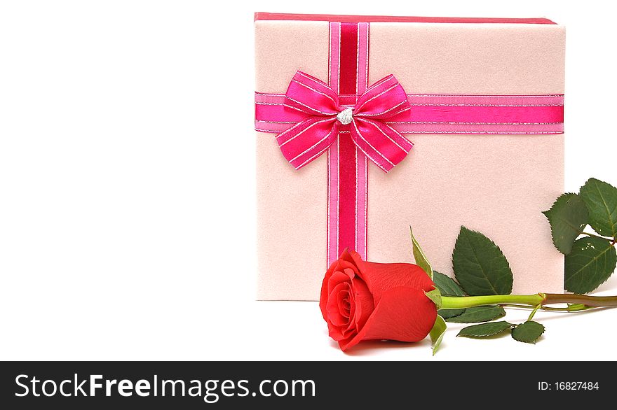 Beautiful red rose and present with ribbon. space for your text. Beautiful red rose and present with ribbon. space for your text