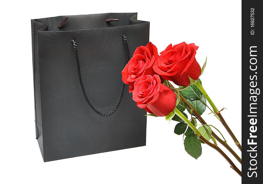 Black bag for a retail shopping experience with red roses. Black bag for a retail shopping experience with red roses