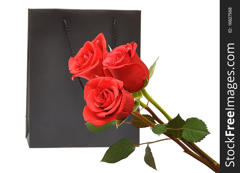 Black bag for a retail shopping experience with red roses. Black bag for a retail shopping experience with red roses