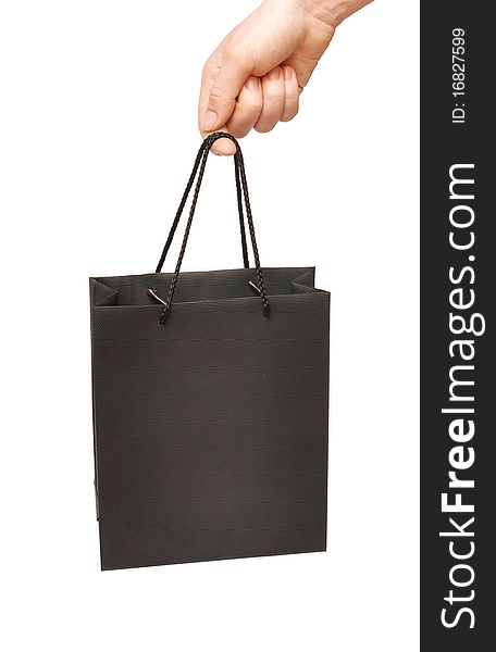 Black bag in female hand isolated background