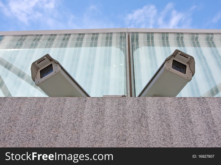 Two surveillance cameras mounted above. Two surveillance cameras mounted above