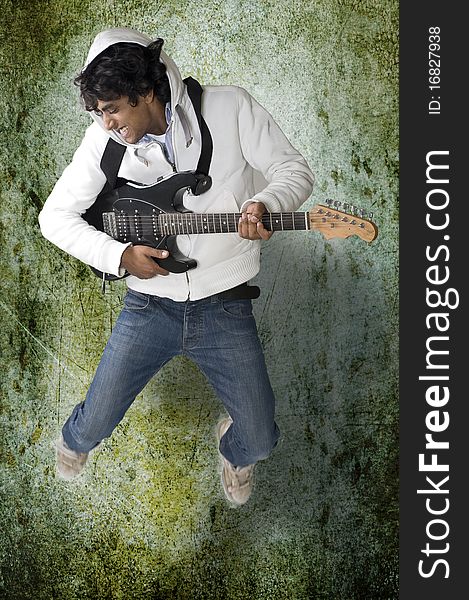 Dancing guitar player on grunge background