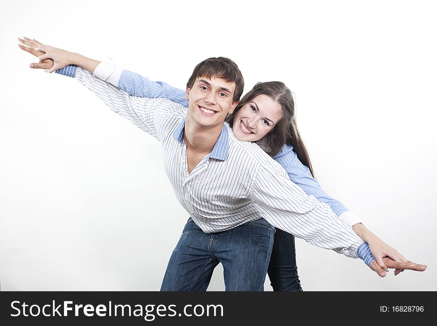 Two young happy person with the hands lifted upwards. Two young happy person with the hands lifted upwards