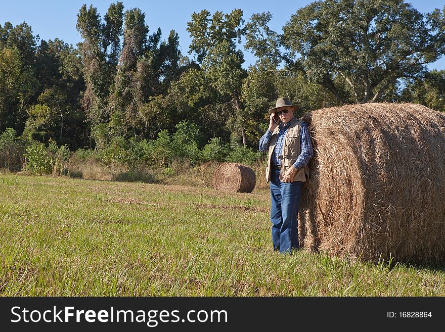 Mature man and hay stack