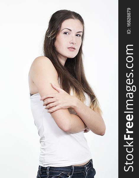 Portrait of beautiful young smiling girl with freckles, isolated on white background