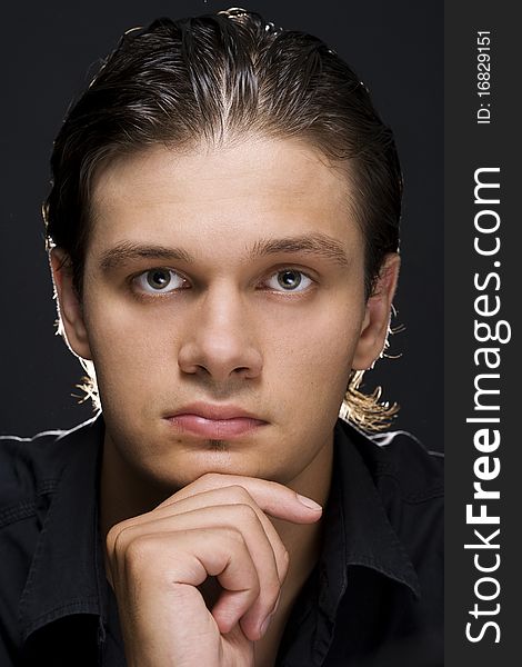 Portrait of young handsome man looking at camera