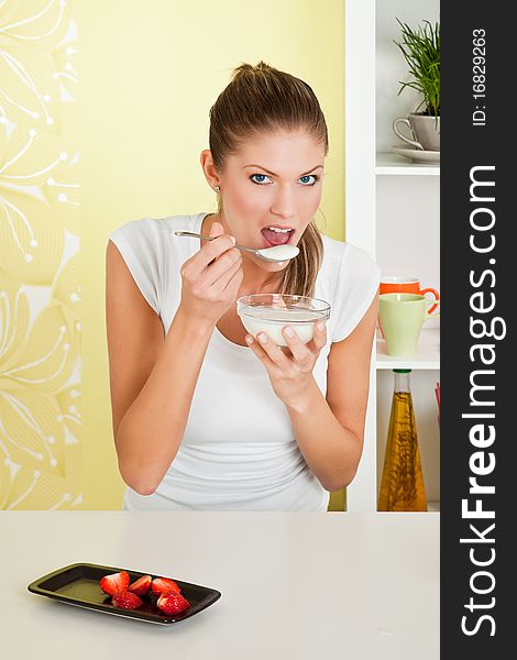 Beauty, young girl eating breakfast with strawberry