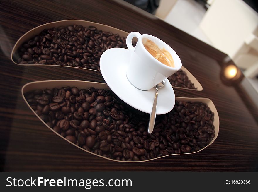 Coffee cup over table - coffee shape