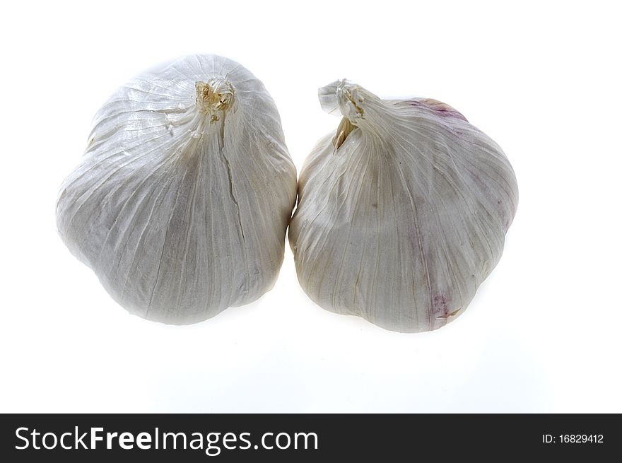 Two garlic bulbs - isolated on white. Two garlic bulbs - isolated on white