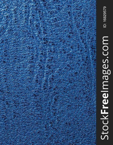 Blue grained leather background, showing detail. Blue grained leather background, showing detail